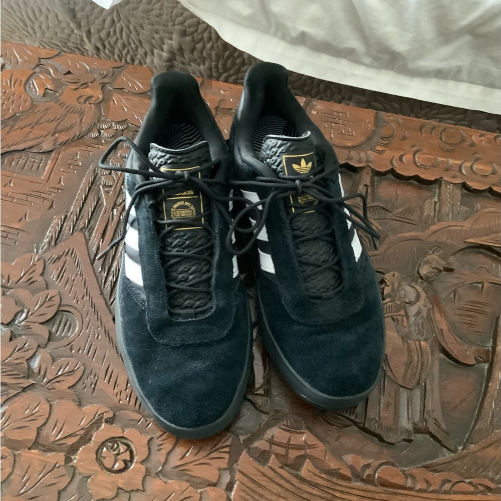 Adidas black suede PUIG sneaker.